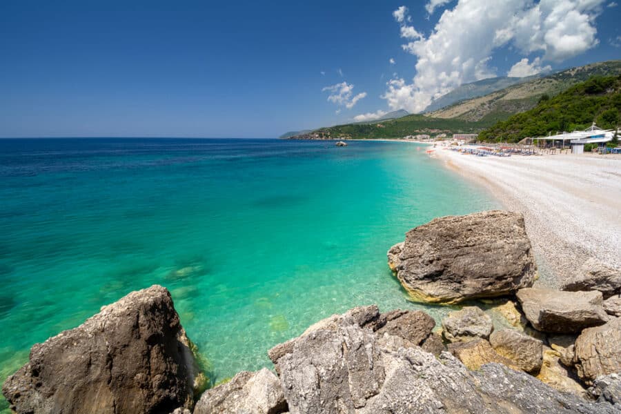 Best Beaches In The Mediterranean - Crystal clear water on Livadhi Beach in Himare in Albania