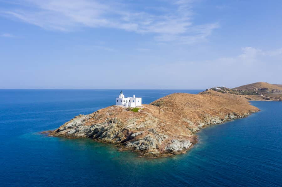 Greece, Kea Tzia island. Lighthouse and white St. Nicolas