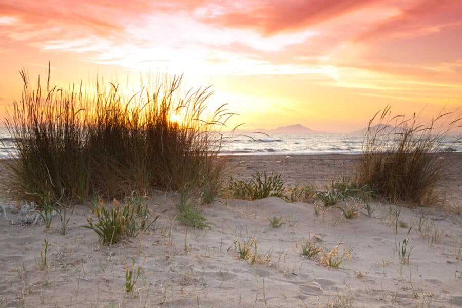 Peloponnese Beaches - Beautiful sunset overlooking the Ionian Sea at the Kalogria Beach in Greece.
