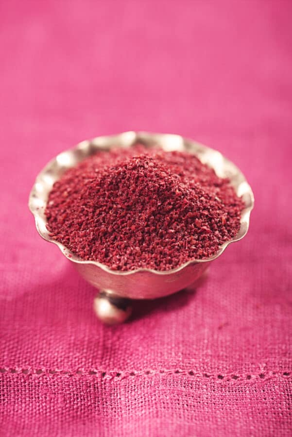Ground Red Sumac Berries spice in silver bowl