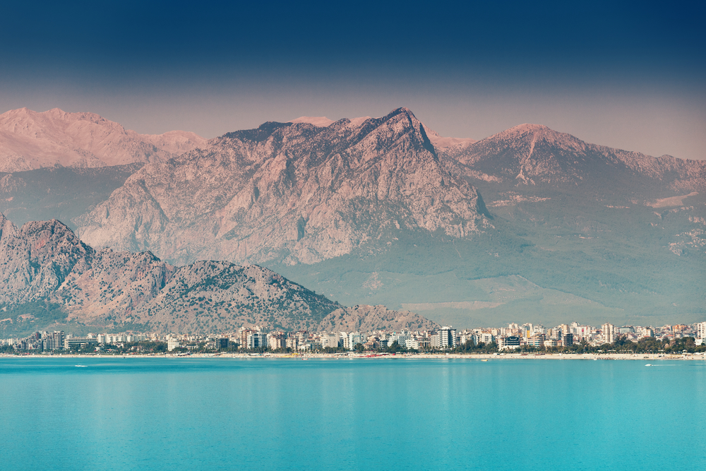 Is Antalya Worth Visiting - Panoramic idyllic view of the sea coast in Antalya. Taurus mountains in the background and the blue Bay of the Mediterranean sea