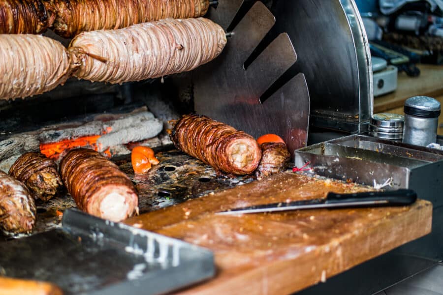 Turkish Street Food Kokorec made with sheep bowel cooked in wood fired oven. fast food.