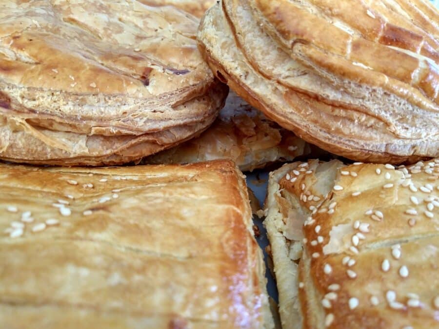 Street food in Athens - Tiropita - Delicious greek breakfast pastry with semolina custard or cheese